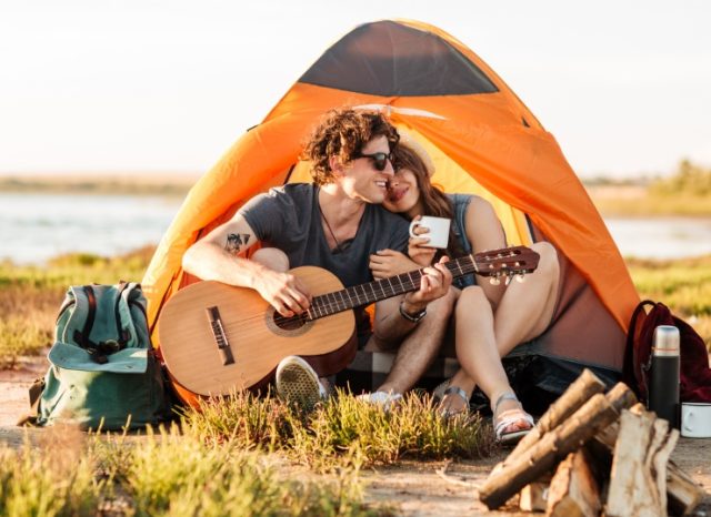 portrait-of-a-man-playing-guitar-for-his-girlfrien-PSKYV3C.jpg